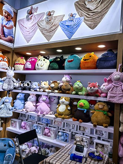 Sample room shelves with plush toy designs, view 7